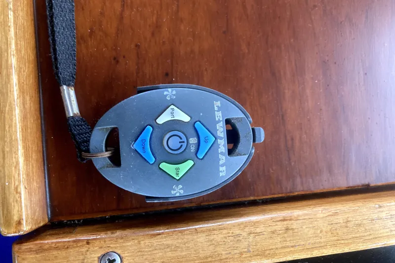 Slide: The Image of Remote control for Lewmar windlass on 1984 Nauticat 33 boat, wooden surface background. - 44