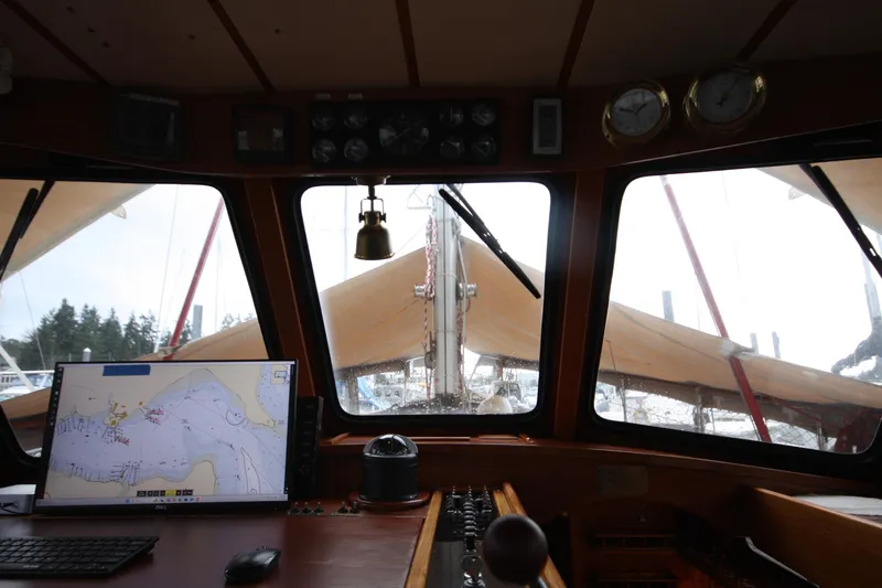Slide: The Image of Interior view of 1984 Nauticat 33 sailboat cockpit with navigation equipment. - 8