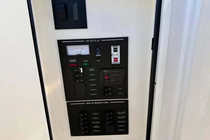 Slide: The Image of Electrical control panel on a 2021 Sea Ray SLX 310 Outboard boat. - 37