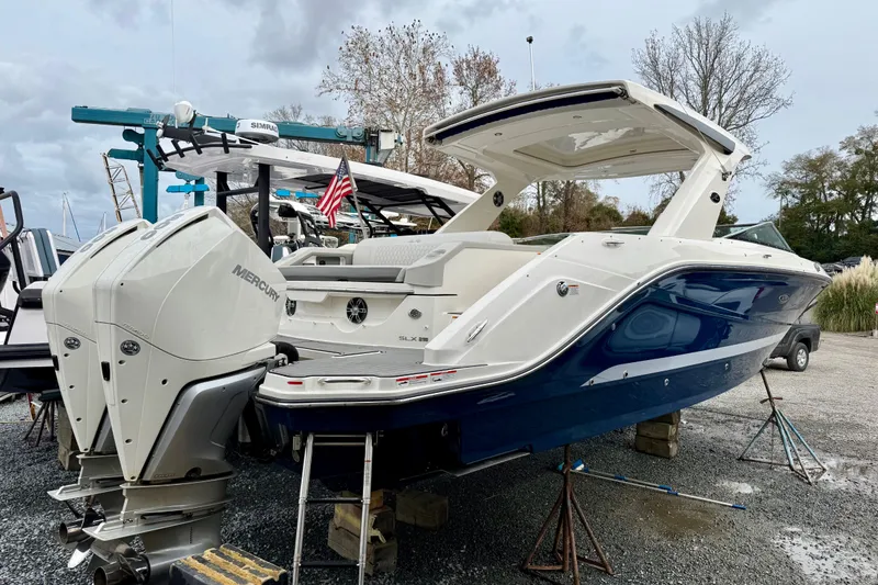 Slide: The Image of 2021 Sea Ray SLX 310 Outboard boat with dual Mercury engines on display. - 41