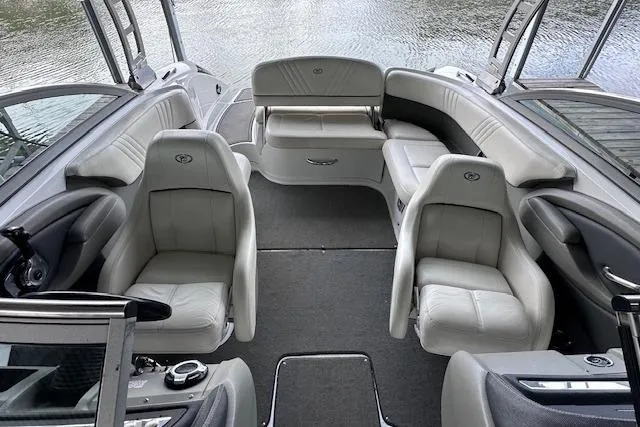 Slide: The Image of 2011 Cobalt 242 WSS boat interior with gray seating and open water view. - 13