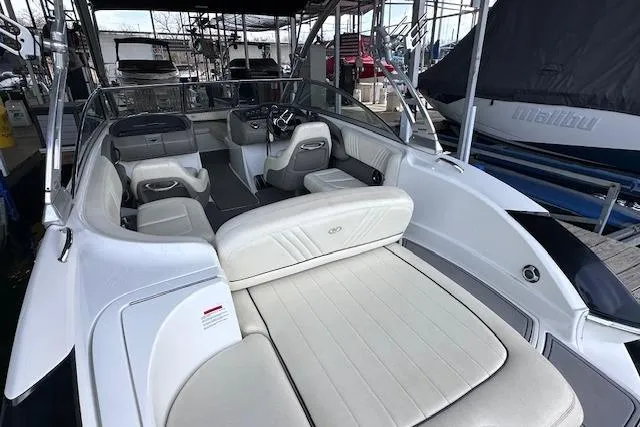 Slide: The Image of 2011 Cobalt 242 WSS boat interior with white seating and sleek design. - 7