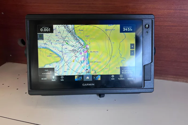 Slide: The Image of Garmin navigation system on a 1989 Catalina 36 sailboat, displaying nautical charts. - 31