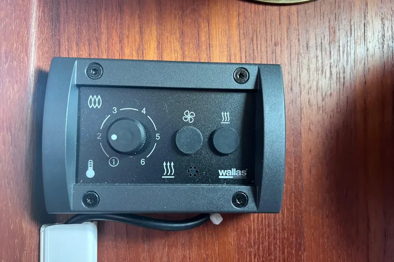 Slide: The Image of Control panel on a 1989 Catalina 36 boat, featuring temperature and fan settings. - 34