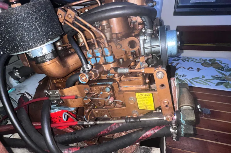 Slide: The Image of Engine of a 1989 Catalina 36 sailboat, showcasing intricate mechanical components. - 38