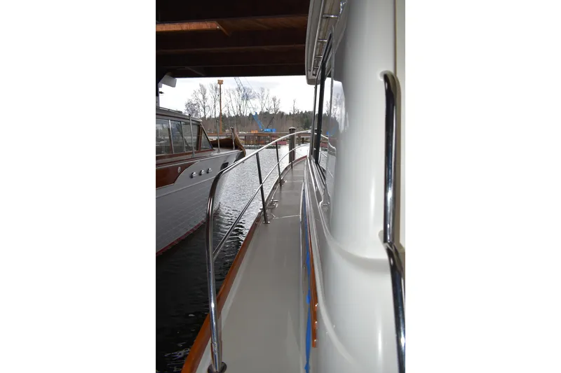 Slide: The Image of Twin 30 amp 125v shore power inlets, along with cable TV and phone cord connection.  - 16