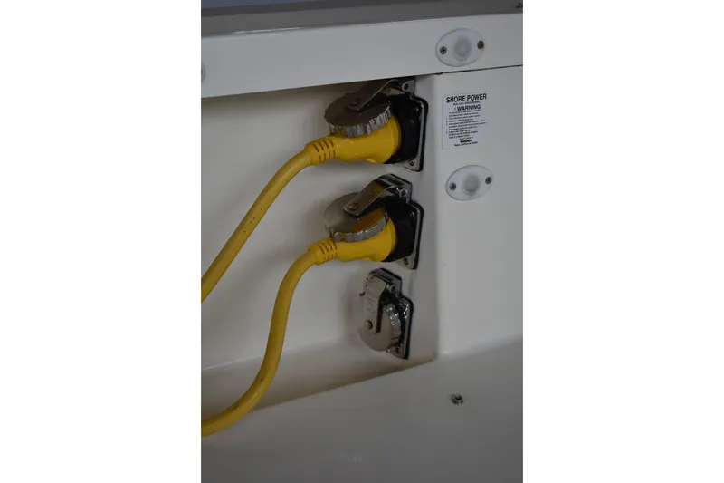 Slide: The Image of Starboard cockpit lazarette access to 12v oil exchange pump system for main engines and generator. - 18