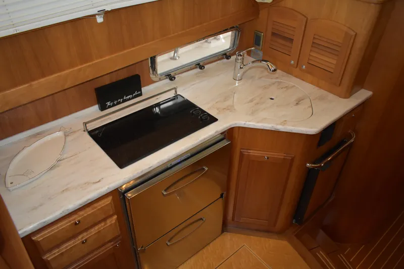 Slide: The Image of Cozy island queen in primary suite. - 49