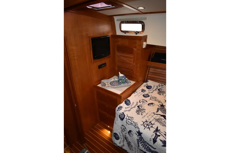 Slide: The Image of Engine room of 2011 Sabre 42 Salon Express with visible hoses and filters. - 57