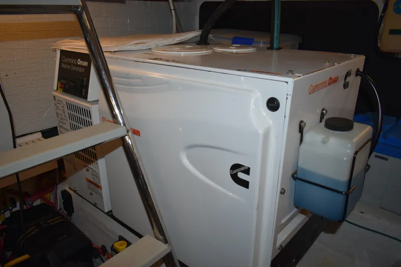 Slide: The Image of 2011 Sabre 42 Salon Express yacht docked in marina under shelter. - 64