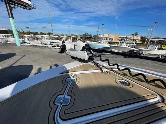 Slide: The Image of Caymas 291HB 2026 boat on a parking lot under sunny skies. - 12