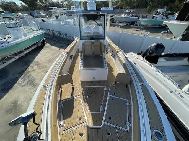 Slide: The Image of Caymas 291HB 2026 boat with sleek design and spacious deck. - 13