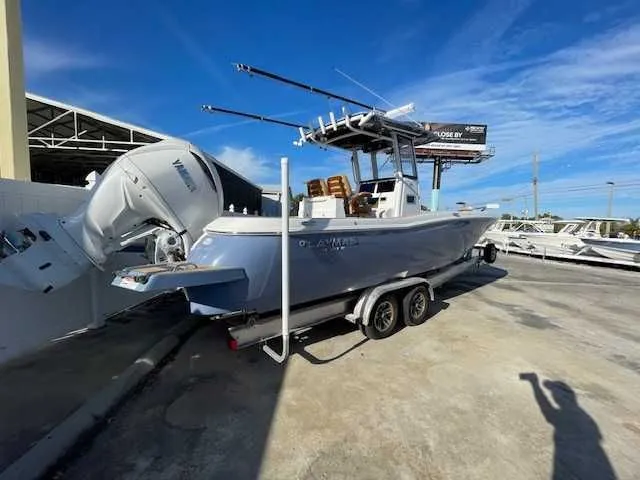 Slide: The Image of 2026 Caymas 291HB boat on trailer outdoors. - 3