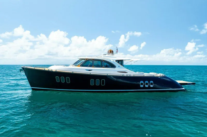 The Image of Luxurious 2019 Zeelander Z55 yacht cruising on clear blue ocean waters. - 1
