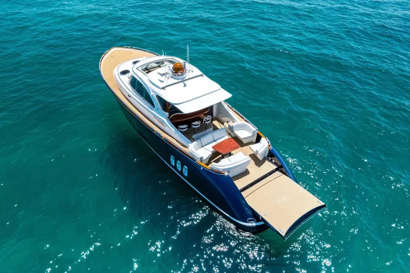 Slide: The Image of 2019 Zeelander Z55 luxury yacht cruising on clear blue ocean waters. - 10