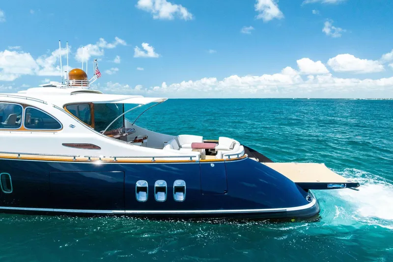 Slide: The Image of Luxurious 2019 Zeelander Z55 yacht cruising on clear blue ocean waters. - 12