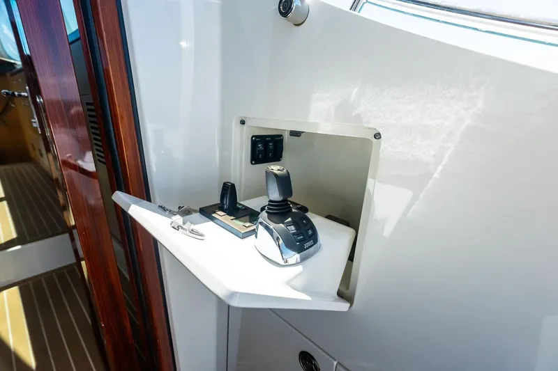 Slide: The Image of Control panel of 2019 Zeelander Z55 yacht with joystick and keys. - 24