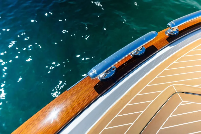Slide: The Image of Zeelander Z55 yacht deck detail with polished wood and ocean view, 2019 model. - 28
