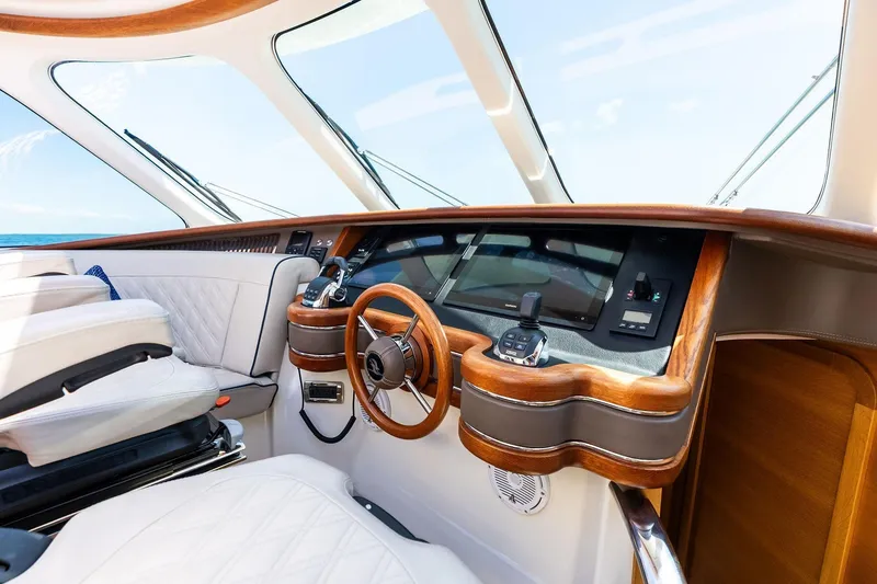 Slide: The Image of Luxurious 2019 Zeelander Z55 yacht helm with elegant wood and leather detailing. - 30