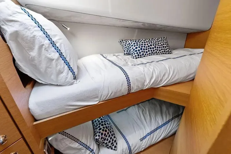 Slide: The Image of Bunk beds in 2019 Zeelander Z55 yacht cabin with polka dot pillows. - 41