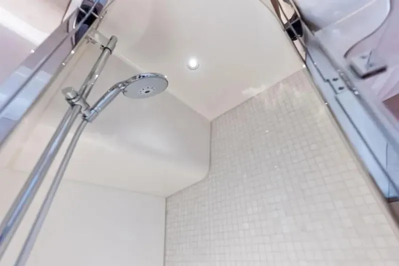Slide: The Image of Shower area in 2019 Zeelander Z55 yacht with modern fixtures and tiled walls. - 58