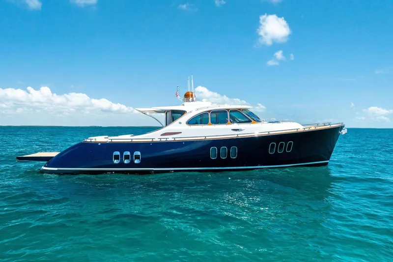 Slide: The Image of 2019 Zeelander Z55 yacht cruising on clear blue ocean waters. - 8