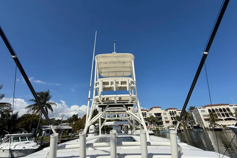 Slide: The Image of 2023 Boston Whaler 360 Outrage boat with tower against clear blue sky. - 22