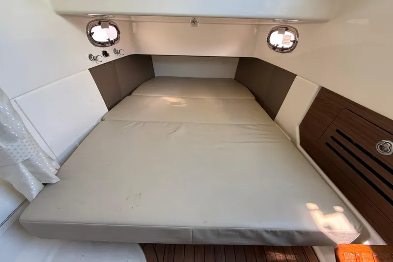 Slide: The Image of 2023 Boston Whaler 360 Outrage cabin interior with comfortable sleeping area. - 26