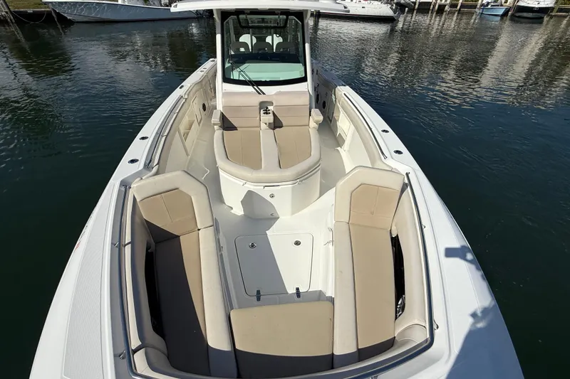 Slide: The Image of 2023 Boston Whaler 360 Outrage boat with spacious seating and sleek design. - 8