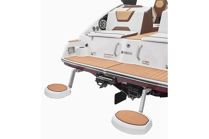 Slide: The Image of 2023 Yamaha Boats SX220 docked, showcasing sleek design and spacious seating. - 5