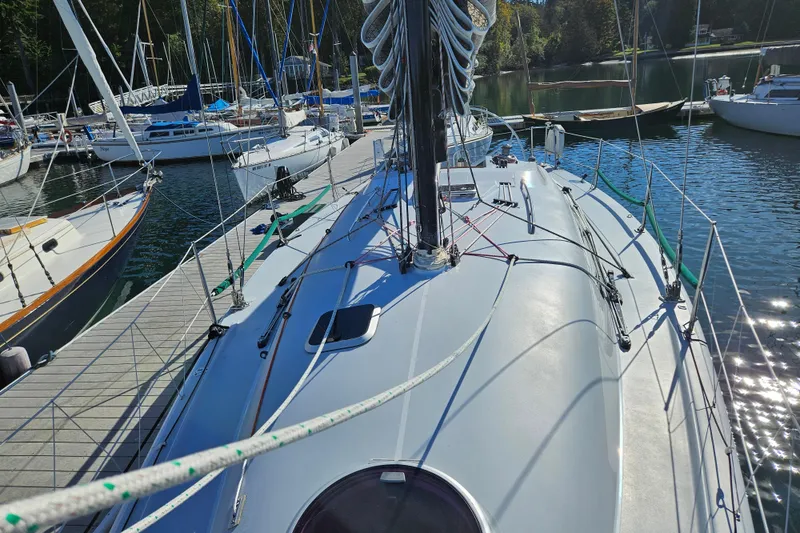Slide: The Image of Sailboat docked at marina, Farr 395 model, 2001, surrounded by other boats. - 10