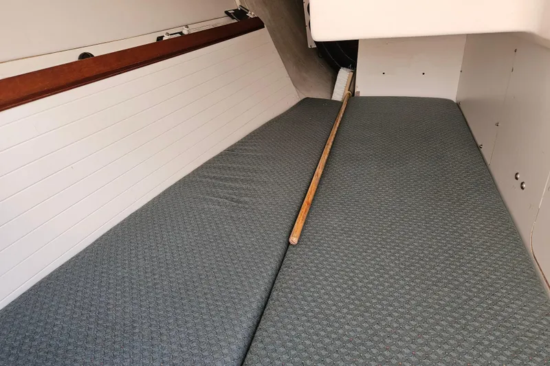 Slide: The Image of Interior cabin of a 2001 Farr 395 sailboat with cushioned seating. - 18