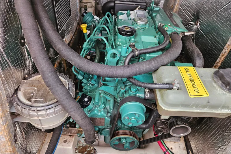 Slide: The Image of Engine compartment of a 2001 Farr 395 sailboat with visible Volvo components. - 22