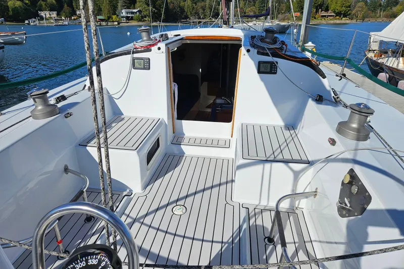 Slide: The Image of Cockpit of 2001 Farr 395 sailboat, featuring sleek design and modern equipment. - 4