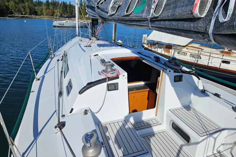 Slide: The Image of Sailboat Farr 395, 2001 model, docked with open cabin, scenic water view. - 6