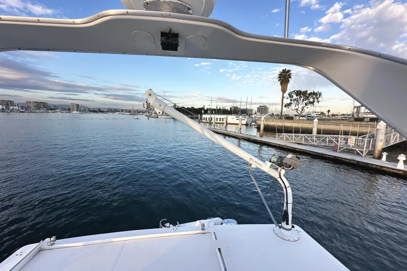 Slide: The Image of Bayliner 3988 Command Bridge Motoryacht 2002 docked at marina with scenic waterfront view. - 29