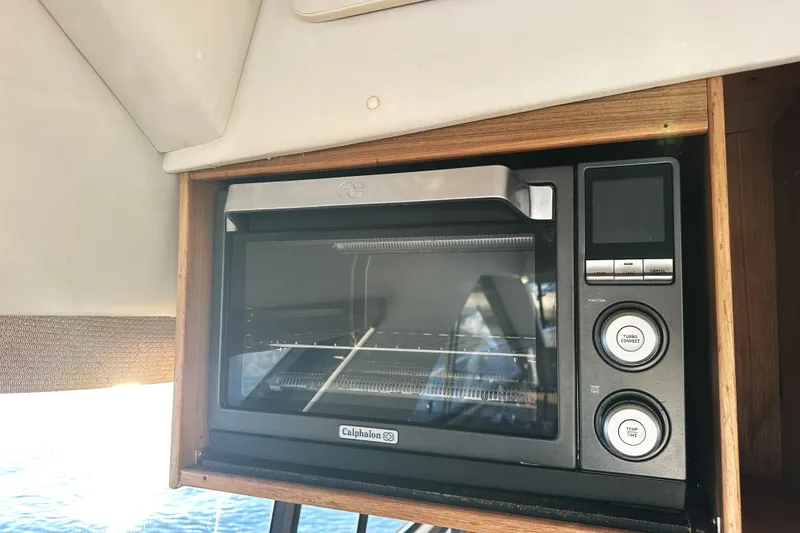 Slide: The Image of Calphalon oven inside 2002 Bayliner 3988 Command Bridge Motoryacht kitchen area. - 36