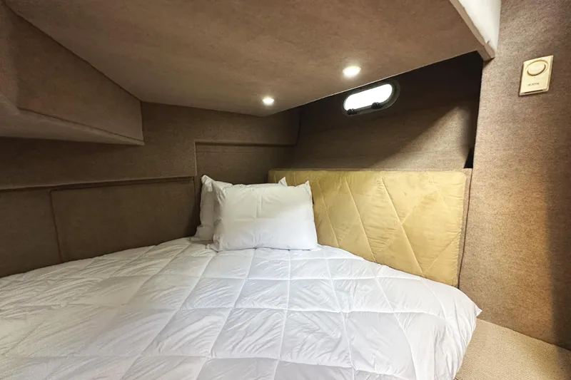 Slide: The Image of Cozy bedroom in 2002 Bayliner 3988 Command Bridge Motoryacht with soft lighting and bedding. - 41