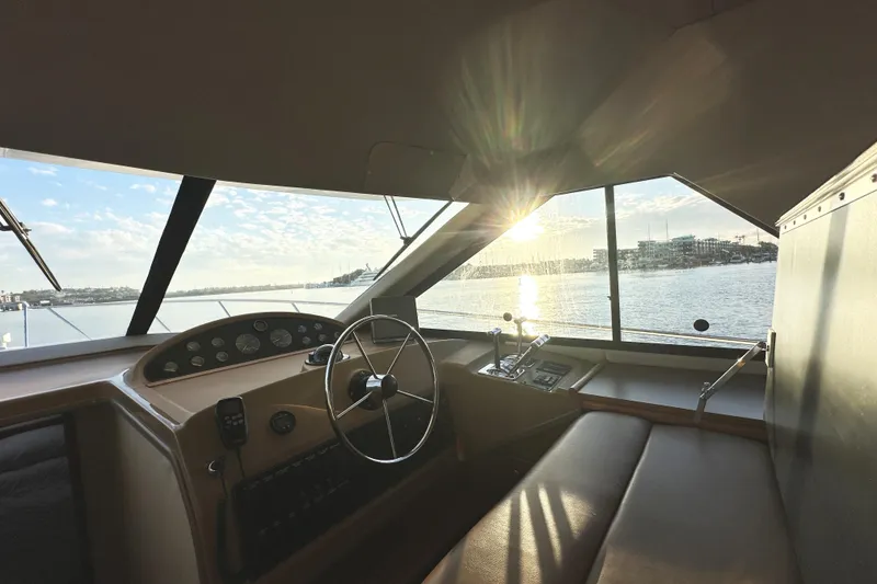 Slide: The Image of Interior view of 2002 Bayliner 3988 Command Bridge Motoryacht with sunset over water. - 43