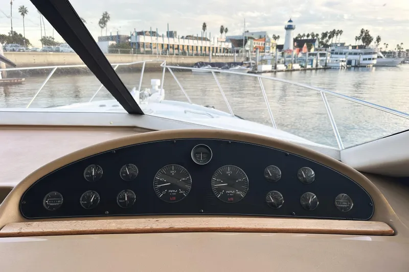 Slide: The Image of Dashboard view of 2002 Bayliner 3988 Command Bridge Motoryacht, overlooking marina. - 44