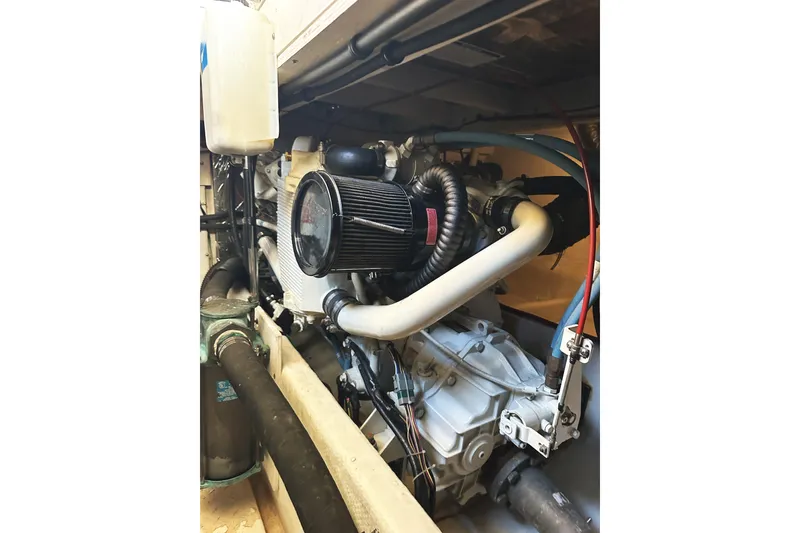 Slide: The Image of Engine compartment of a 2002 Bayliner 3988 Command Bridge Motoryacht, showcasing mechanical components. - 47
