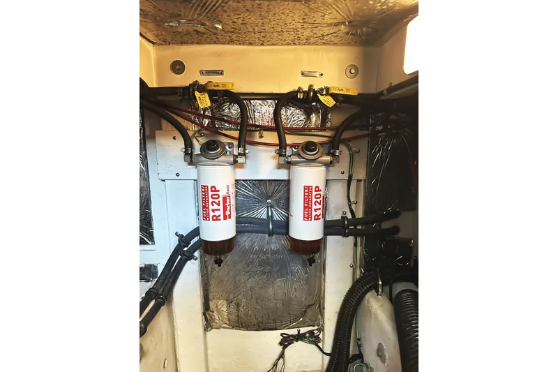 Slide: The Image of Engine room of 2002 Bayliner 3988 Command Bridge Motoryacht with dual fuel filters. - 48