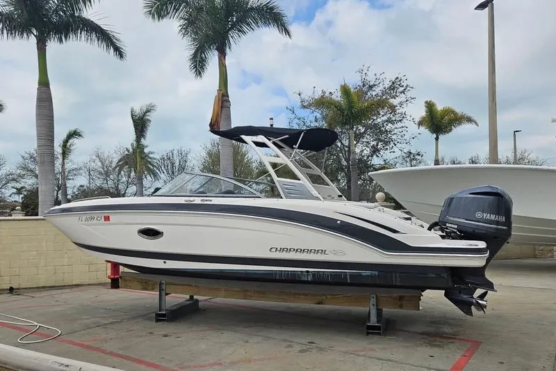 Slide: The Image of 2018 Chaparral 250 Suncoast boat on display with Yamaha outboard motor. - 10