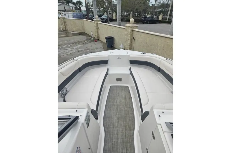 Slide: The Image of 2018 Chaparral 250 Suncoast boat interior with spacious seating and sleek design. - 4