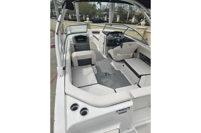 Slide: The Image of 2018 Chaparral 250 Suncoast boat interior with seating and helm, showcasing modern design. - 6