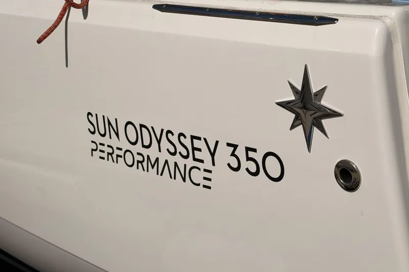 Slide: The Image of 2025 Jeanneau Sun Odyssey 350 Performance yacht emblem with star design. - 15