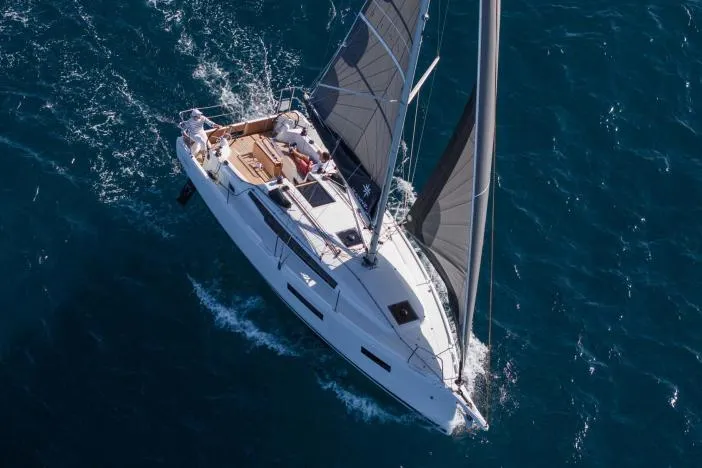 Slide: The Image of Manufacturer Provided Image: 2025 Jeanneau Sun Odyssey 350 sailing on open sea, aerial view. - 2