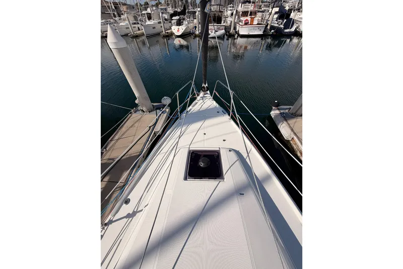 Slide: The Image of 2025 Jeanneau Sun Odyssey 350 sailboat docked in marina, viewed from deck. - 27