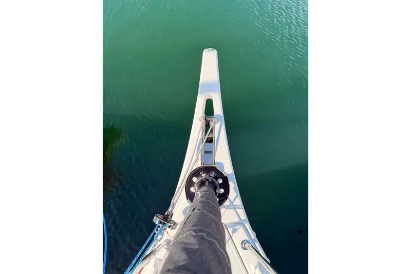 Slide: The Image of Bow view of 2025 Jeanneau Sun Odyssey 350 sailboat on calm water. - 31