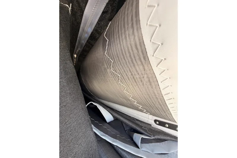 Slide: The Image of Close-up of Jeanneau Sun Odyssey 350 sail stitching, 2025 model. - 36